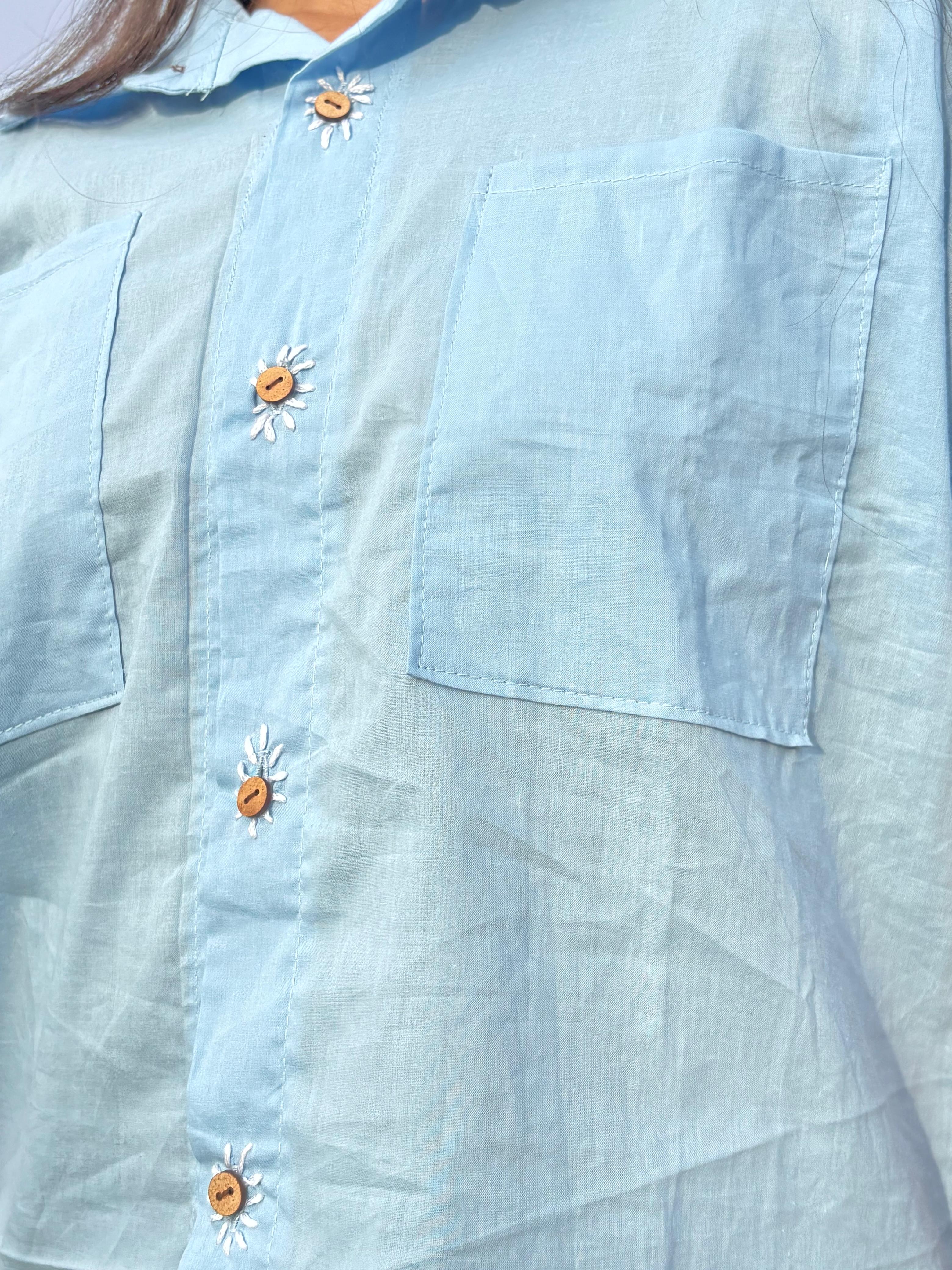 The plwder blue shirt