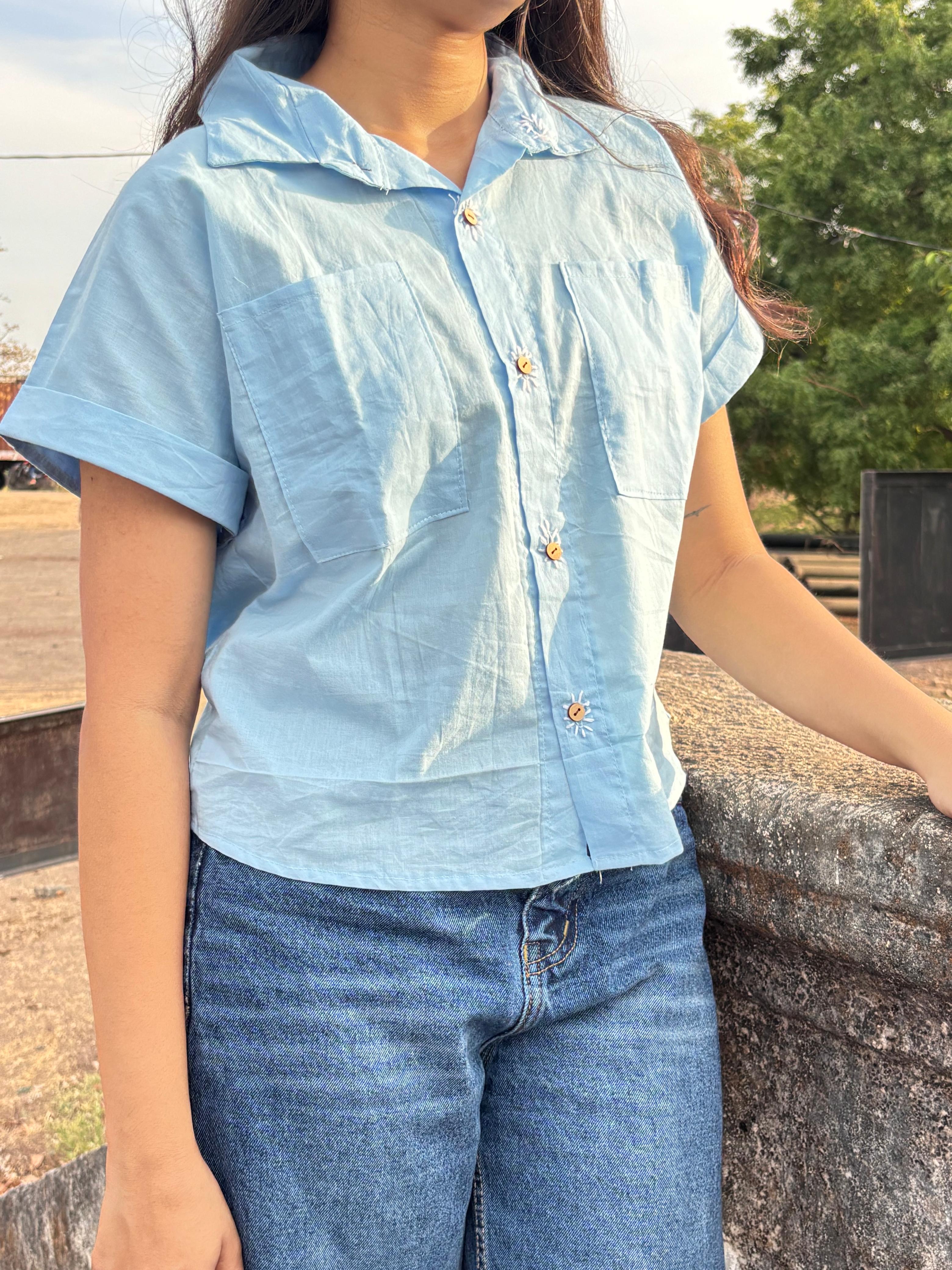 The plwder blue shirt